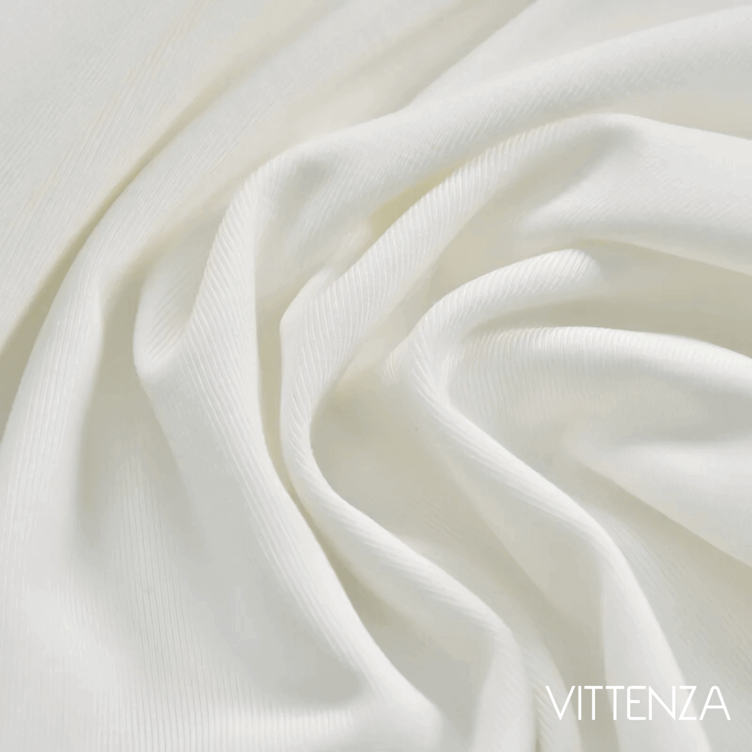 Close-up of the white Artemis Dress fabric, showcasing its soft, lightweight, and flowing texture.