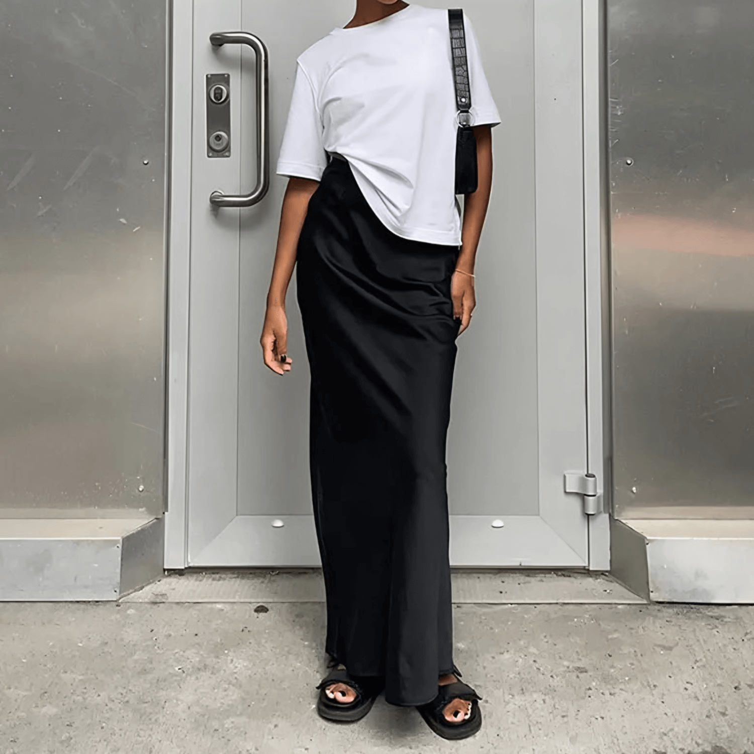 Model wearing the Basic Long Skirt, paired with a white top.