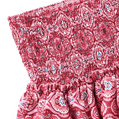 Close-up of the burgundy patterned high-waisted ruffle skirt showing smocked waistband and fabric details.