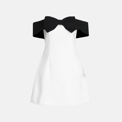 Front view of a classic black and white off-shoulder dress with a bow detail.