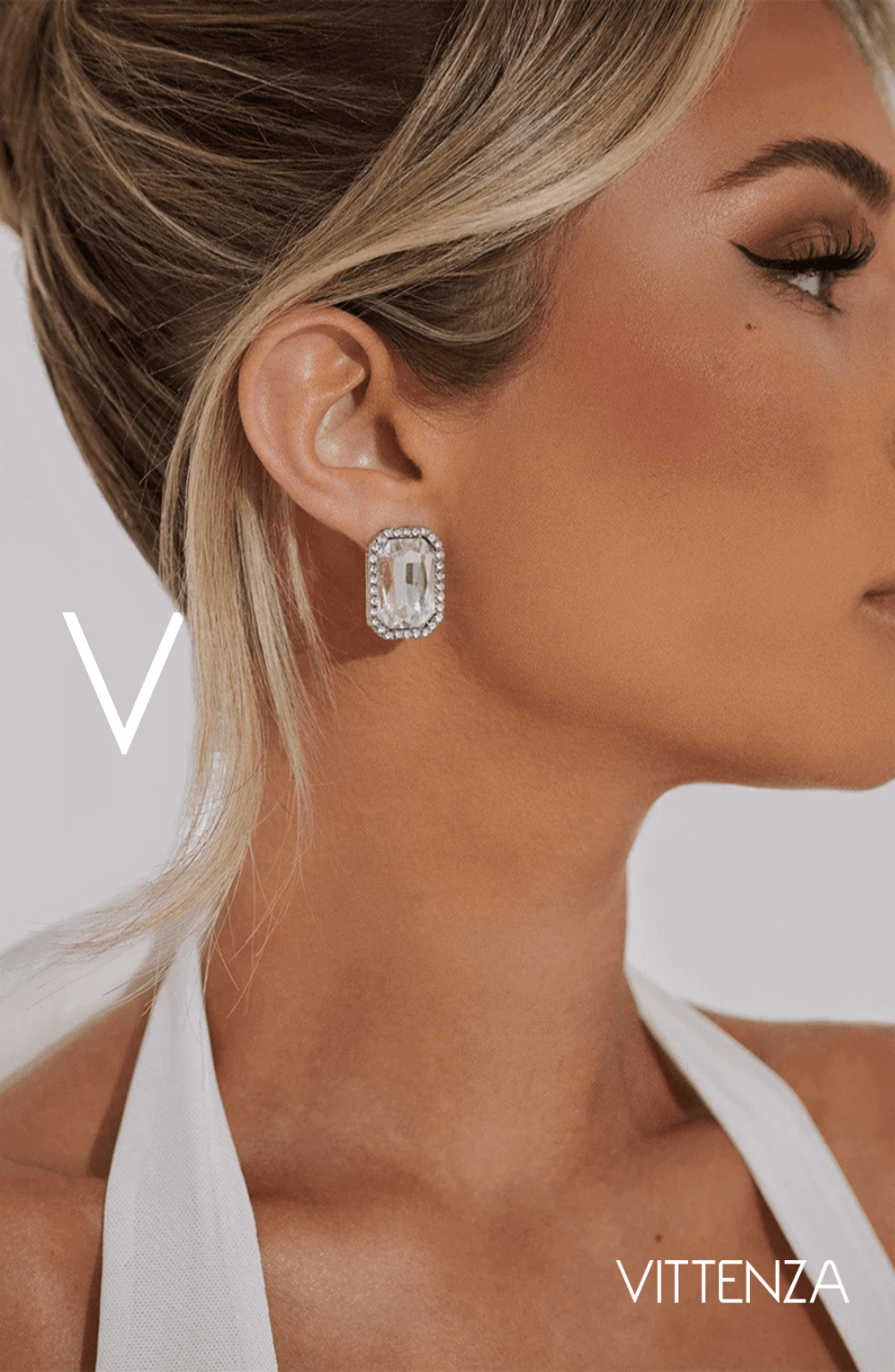 Close-up of Odessa Earrings featuring a bold square rhinestone design, worn by a model with an elegant updo.