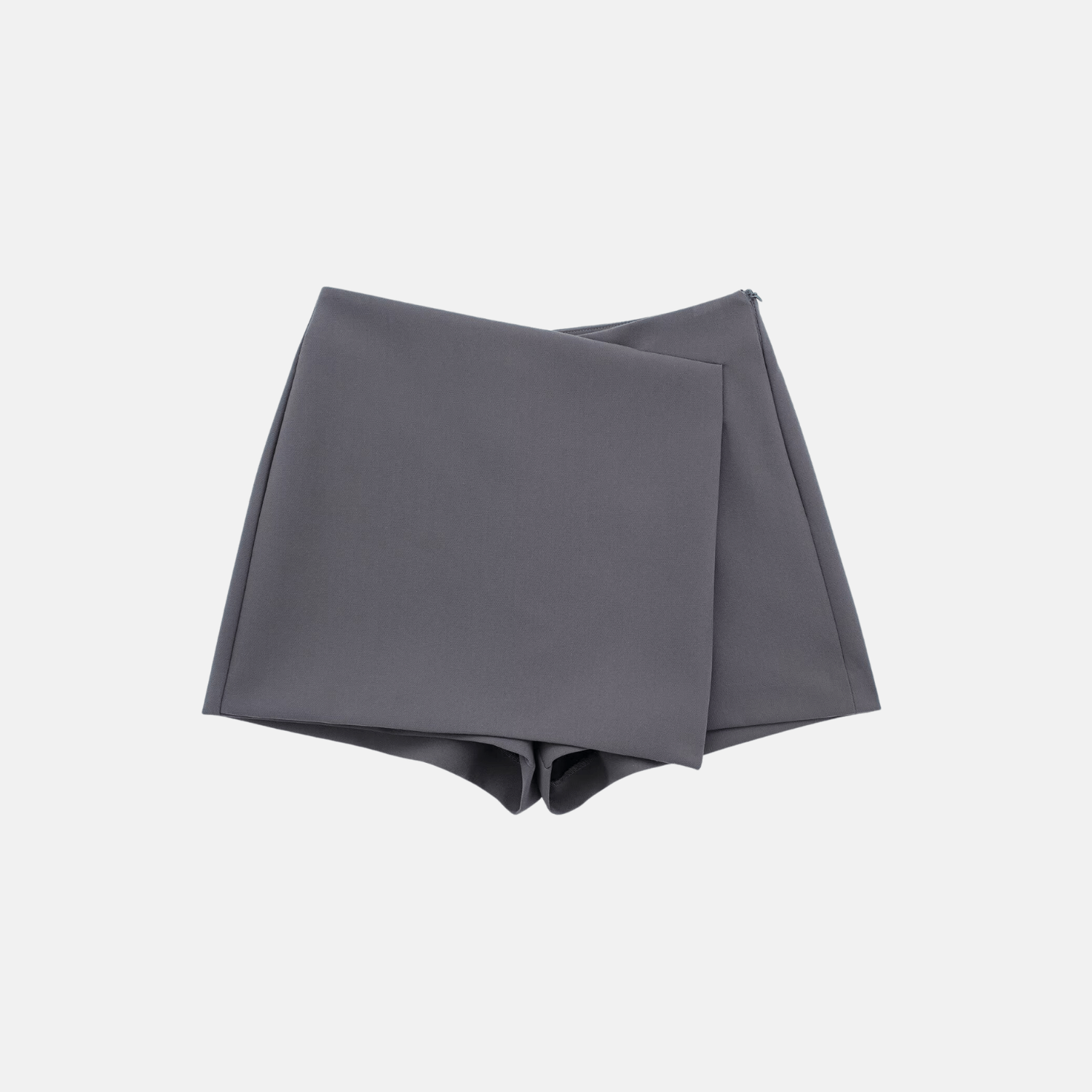 Flat lay of the gray Barbie Shorts Skirt showcasing its asymmetrical design and clean lines.