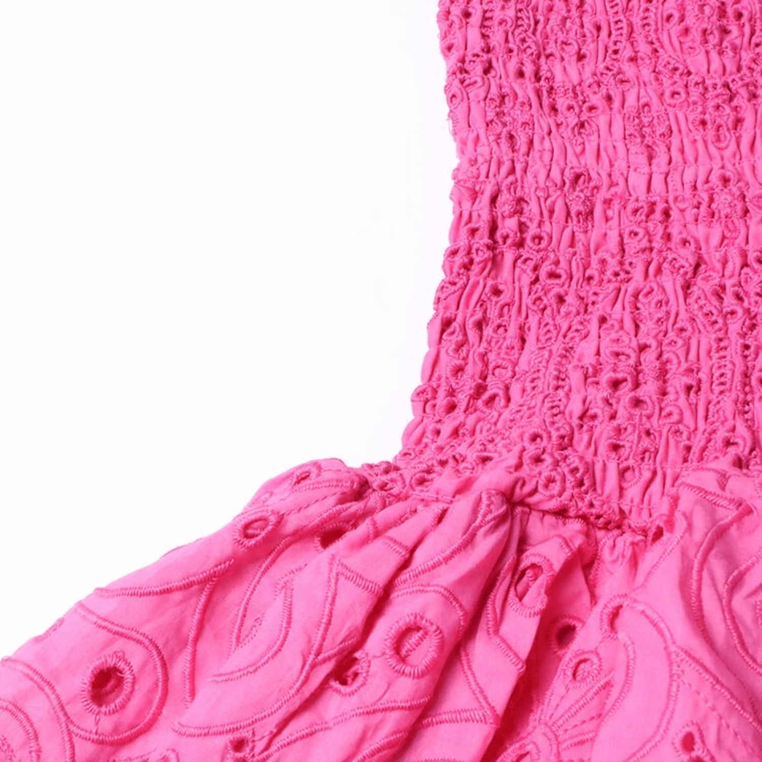 Close-up of the Gummy Dress elastic bodice and embroidered fabric in vibrant pink.