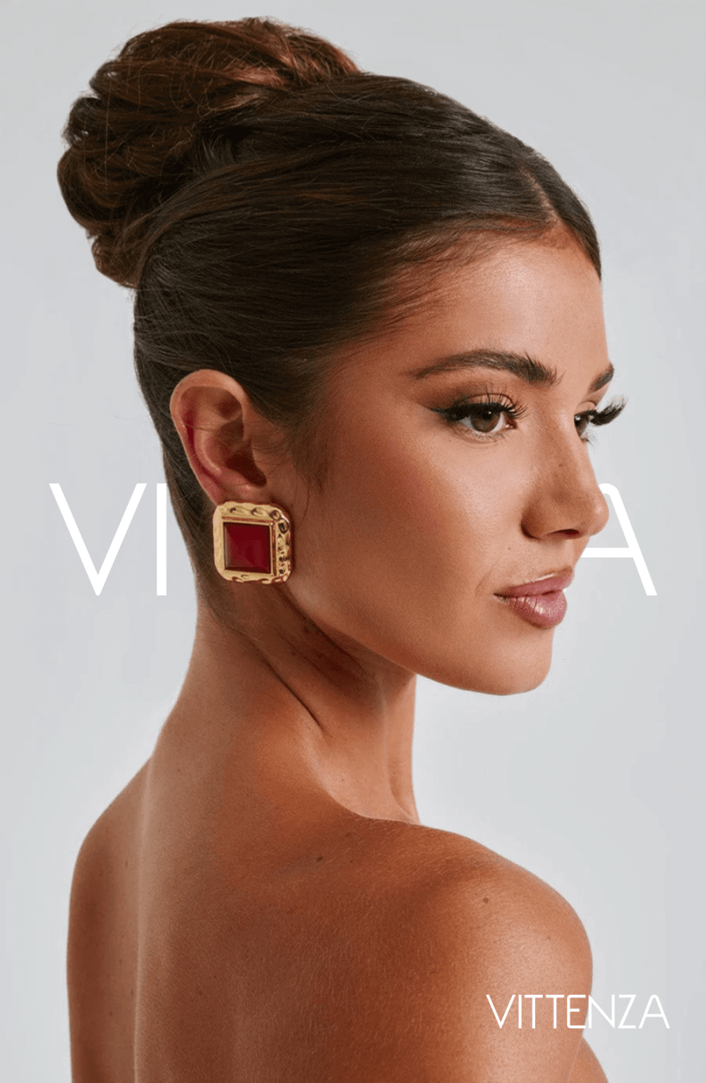 Front view of Kennedy Earrings in red and gold, highlighting the smooth stone center and textured frame for a bold, elegant look.