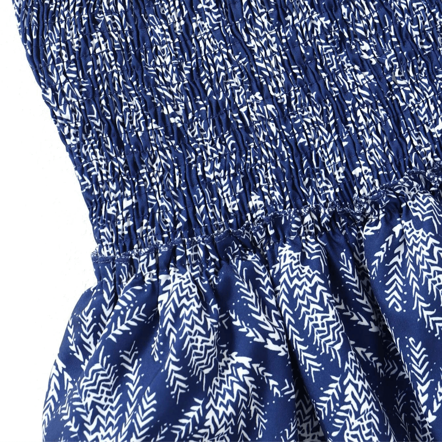 Close-up of the navy blue patterned high-waisted ruffle skirt showing smocked waistband and fabric details.