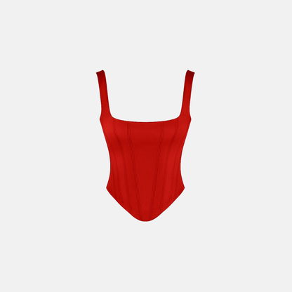 A flat-lay of the red corset, highlighting its vibrant color and structured design on a plain background.