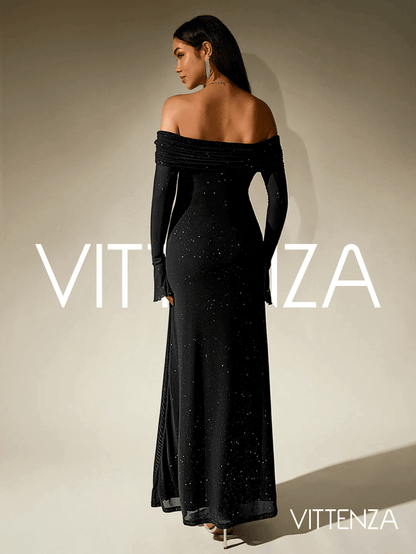 Back view of the Stellar Sparkle Maxi Dress in shimmering black, showcasing the off-shoulder design, long sleeves, and a flattering floor-length silhouette. The model accessorizes with statement earrings and sleek jewelry.