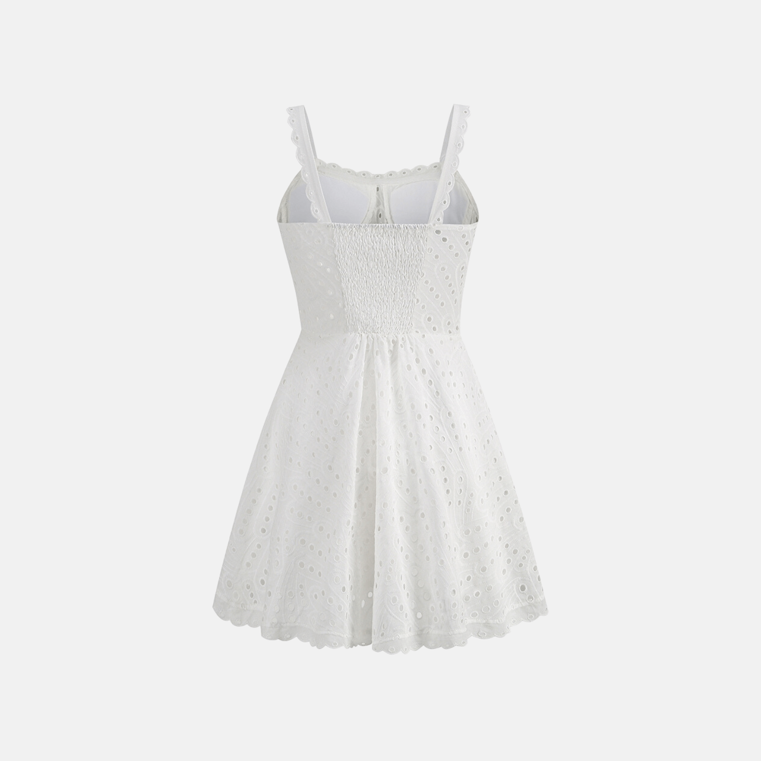 Back view of the white Bali Dress, featuring a shirred elastic back panel and delicate embroidery details.